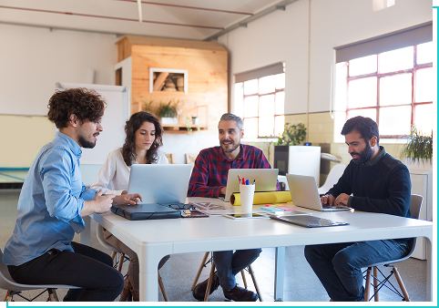 Team at Web An Fix collaborating at a table